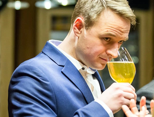 Me in 2016 examining the aroma of a blonde beer in a wine glass